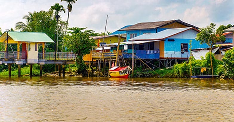 A village by the river in Sarawak, Kuching, Malaysia A village by the river in Sarawak, Kuching, Malaysia
